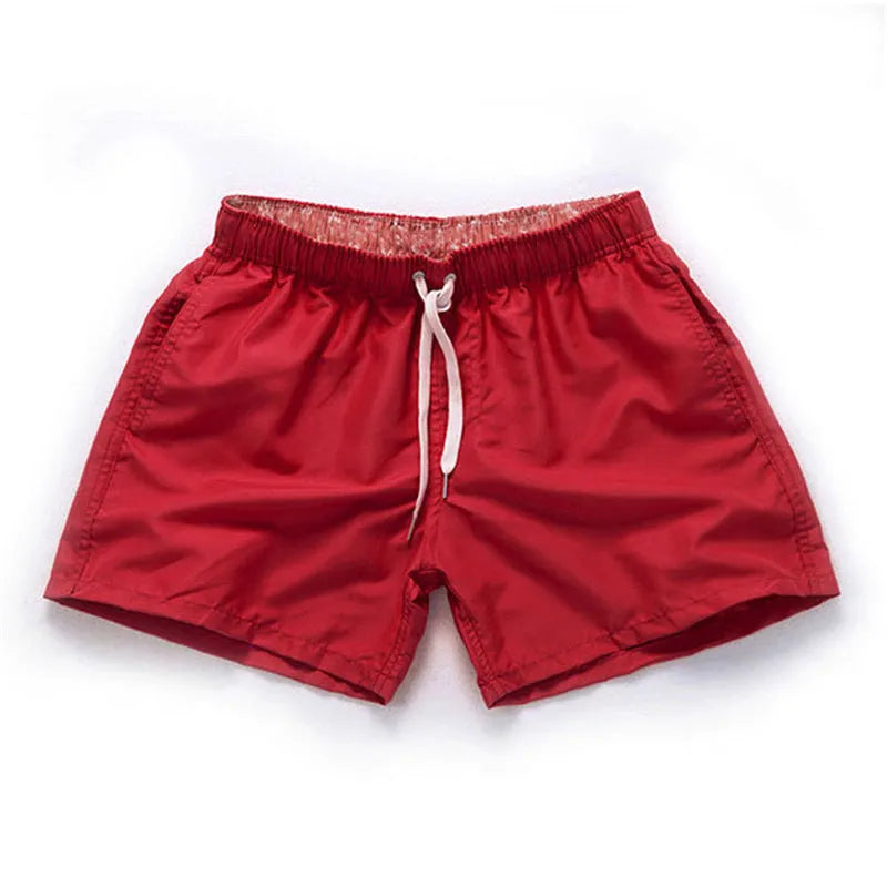 Men's polyester beach shorts in multiple colours with straight leg opening, suitable for surfing and swimming
