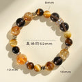 Natural yellow crystal bead bracelet with 10mm Jinba beads on wrist