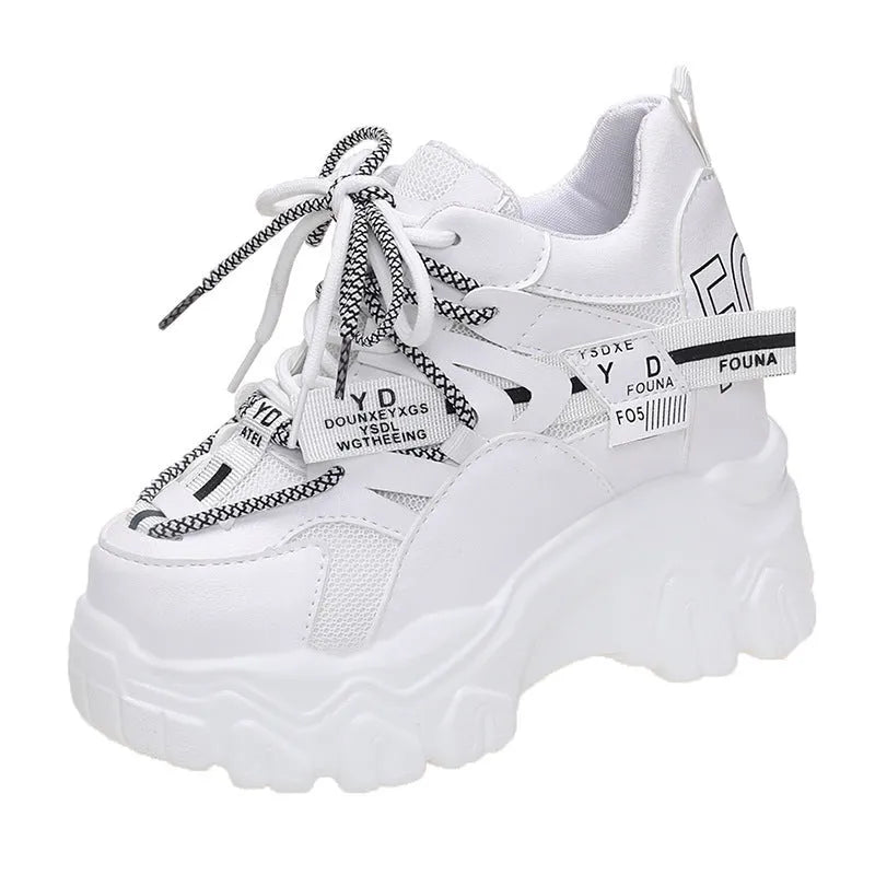 White women's mesh platform sports shoes with cross-strap detail and rubber sole.