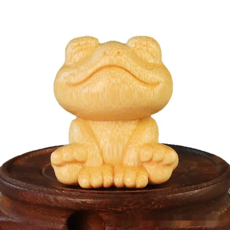 Solid bamboo smiling frog carving ornament measuring 5cm height for decorative gifts
