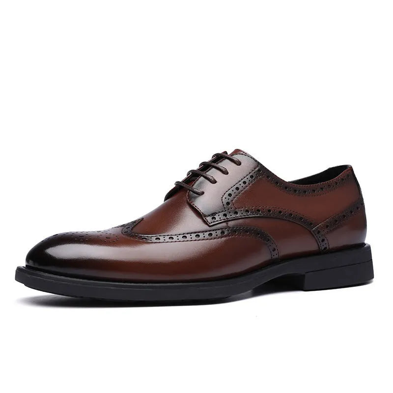 Men's black brogue leather shoes with decorative perforations and lace-up front.
