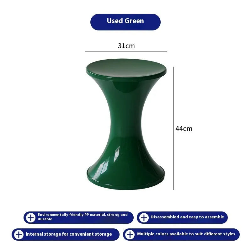 A plastic hourglass-style shoe changing stool in one of five available colours: black, green, red, white, or brown.