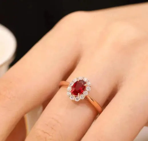 Women's silver ring with blood ruby artificial gemstone and gold pigeon floral design