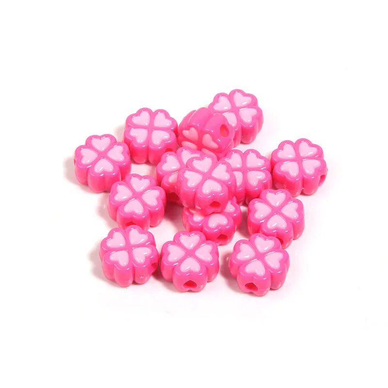 Acrylic clover craft beads with frosted finish in mixed colours including pink, blue and green