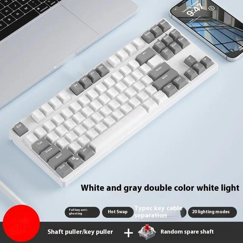 87 key wired mechanical keyboard with metal chassis shown in a black, orange, and yellow colour configuration.