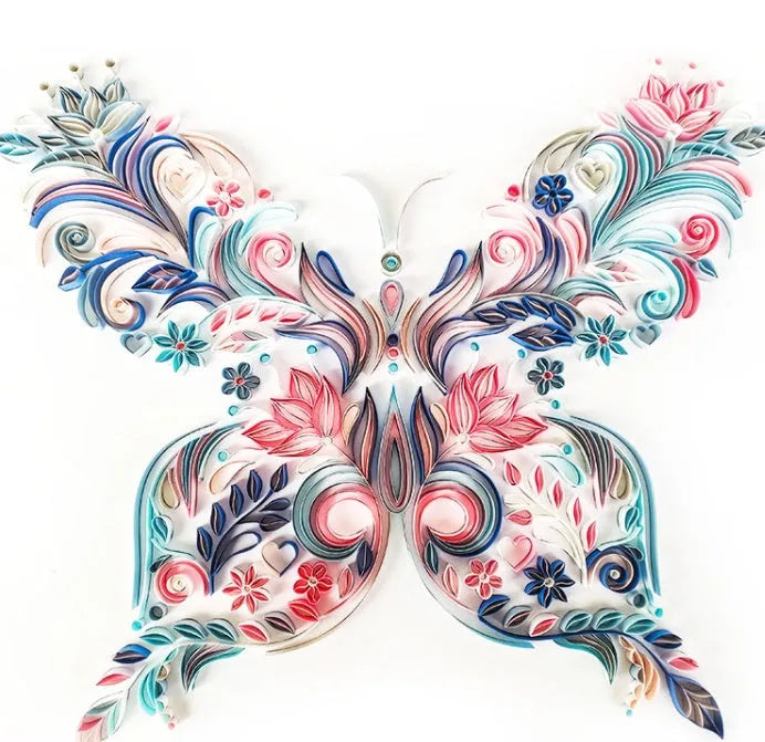 20 inch handmade butterfly quilling paper ornament with craft tools on blue background
