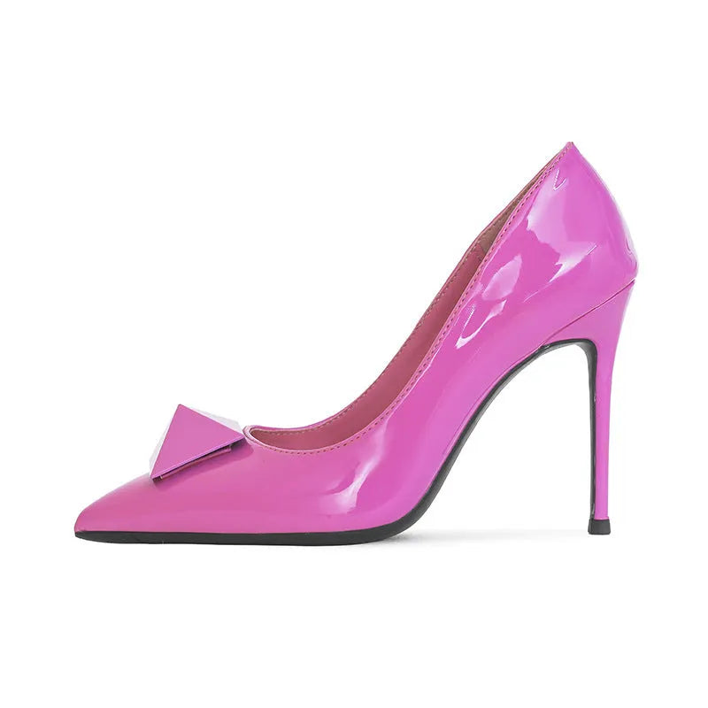 Women's pink patent leather pointed toe stiletto heels with buckle detail and super high heel