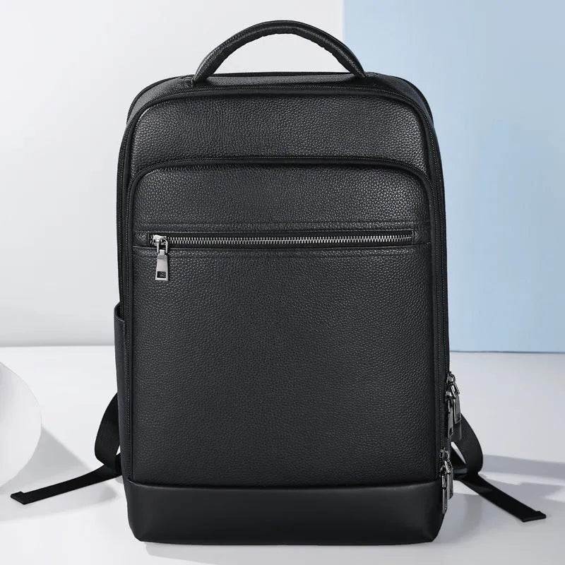 Black genuine leather men's business backpack with curved shoulder straps and sewing line detailing