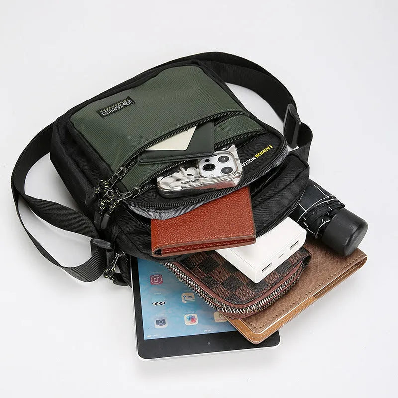 Men's solid colour nylon crossbody bag with adjustable shoulder strap in urban simplicity style.