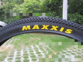 Ultralight mountain bike tyre with reinforced sidewall, shown in a 29x2.1 size with white label.