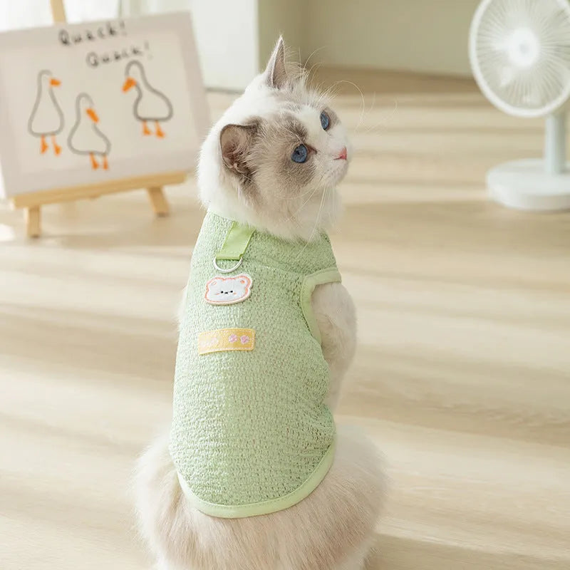 Hollowed-out cat clothes with bear patch in knitted fabric, shown in green colour