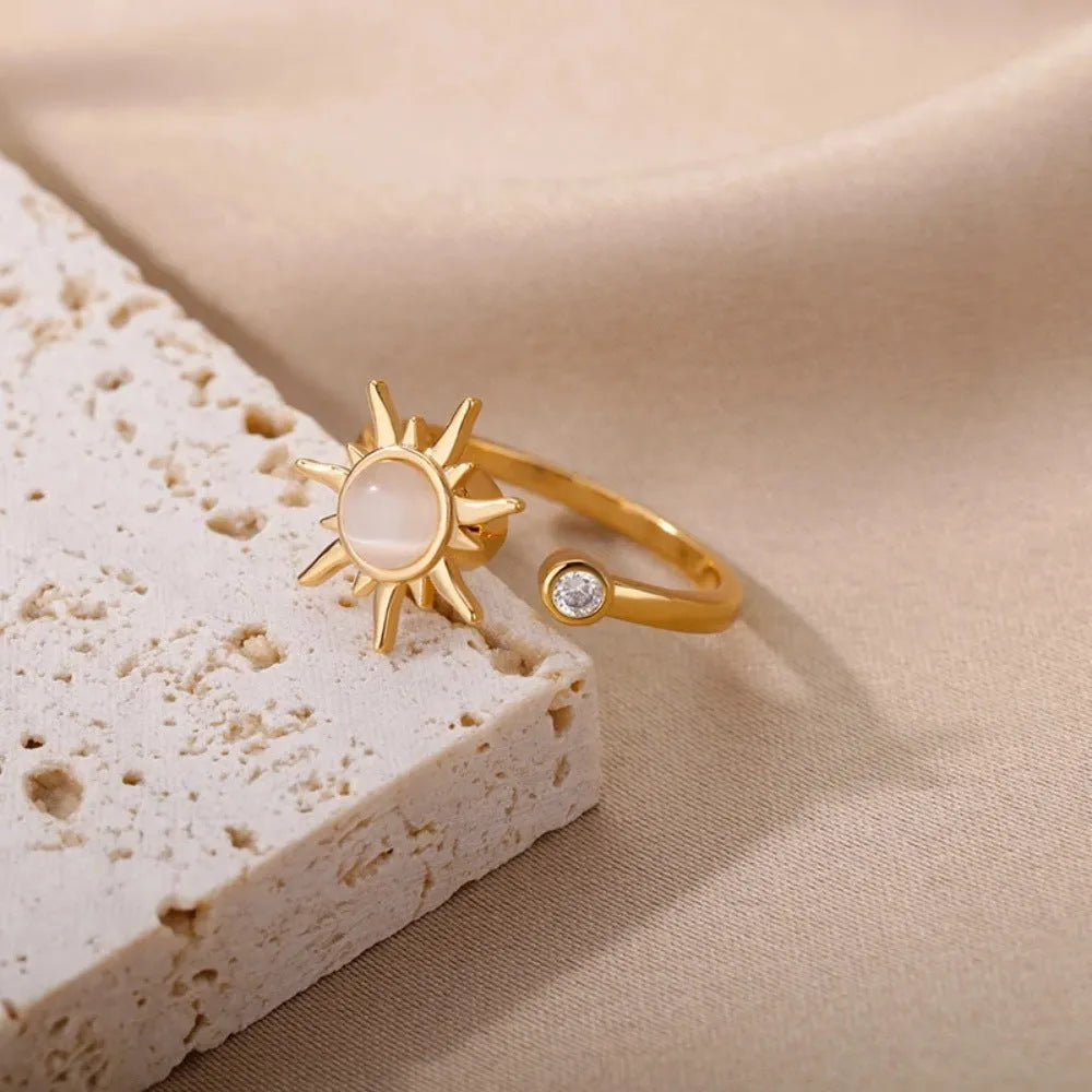 Gold and platinum electroplated copper decompression ring with rotatable design and adjustable opening