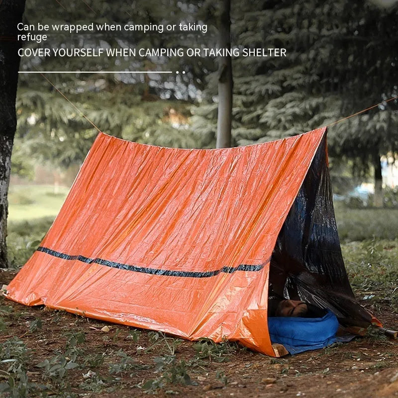 Portable orange disaster relief tent with sleeping bag and emergency blanket for emergency shelter
