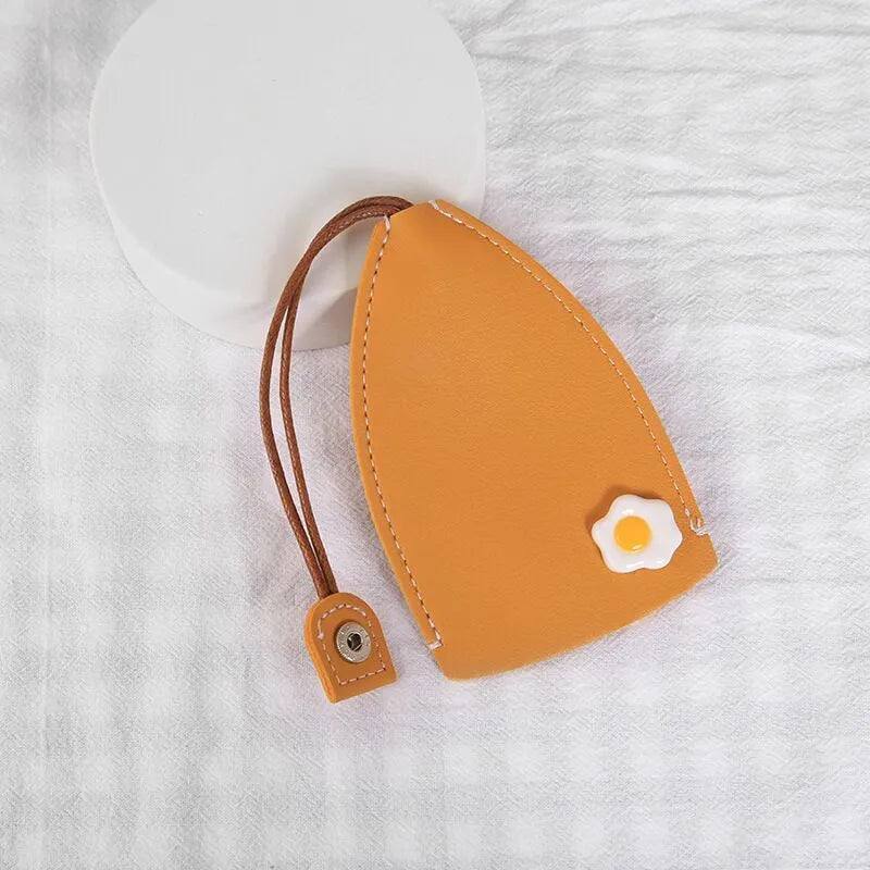 Colourful cartoon pull-out key case made from PU leather, showing the key extended from its protective sleeve.