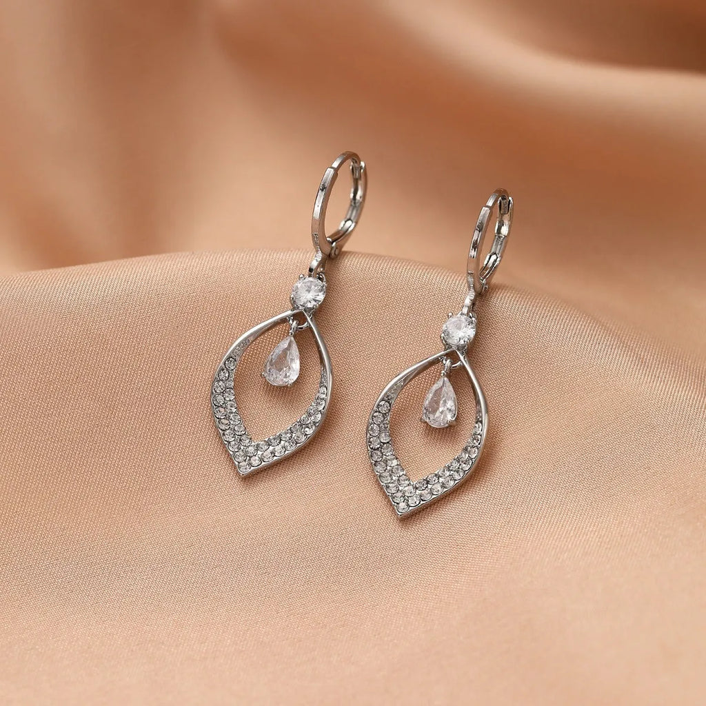Copper tear-drop shaped earrings with zircon detailing and tassel finish, showing gold and silver electroplated buckle options