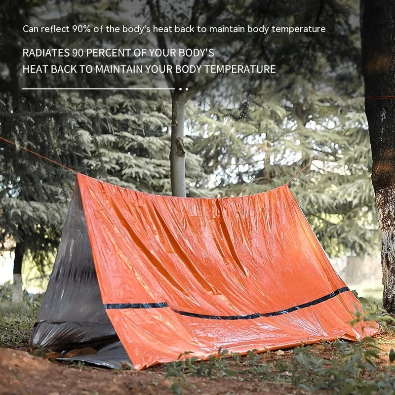 Portable orange disaster relief tent with sleeping bag and emergency blanket for emergency shelter