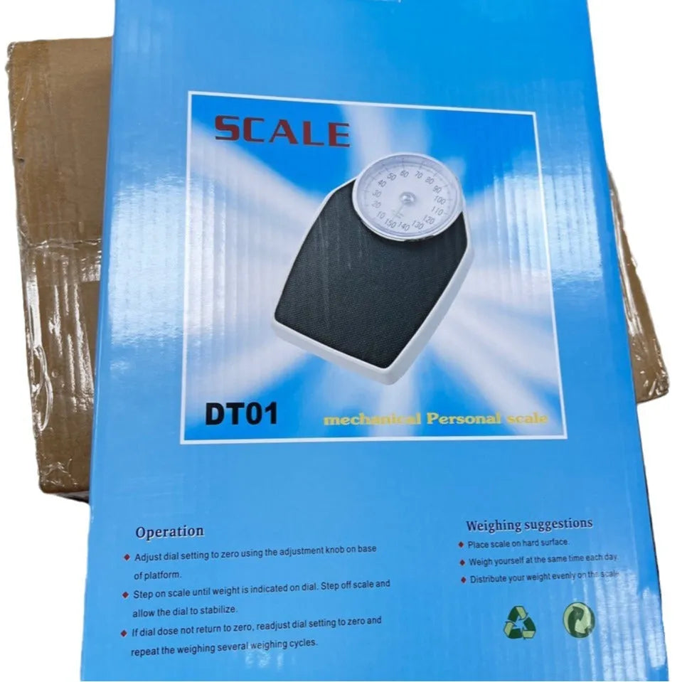 Black mechanical bathroom weight scale with large analogue dial on a simple platform.