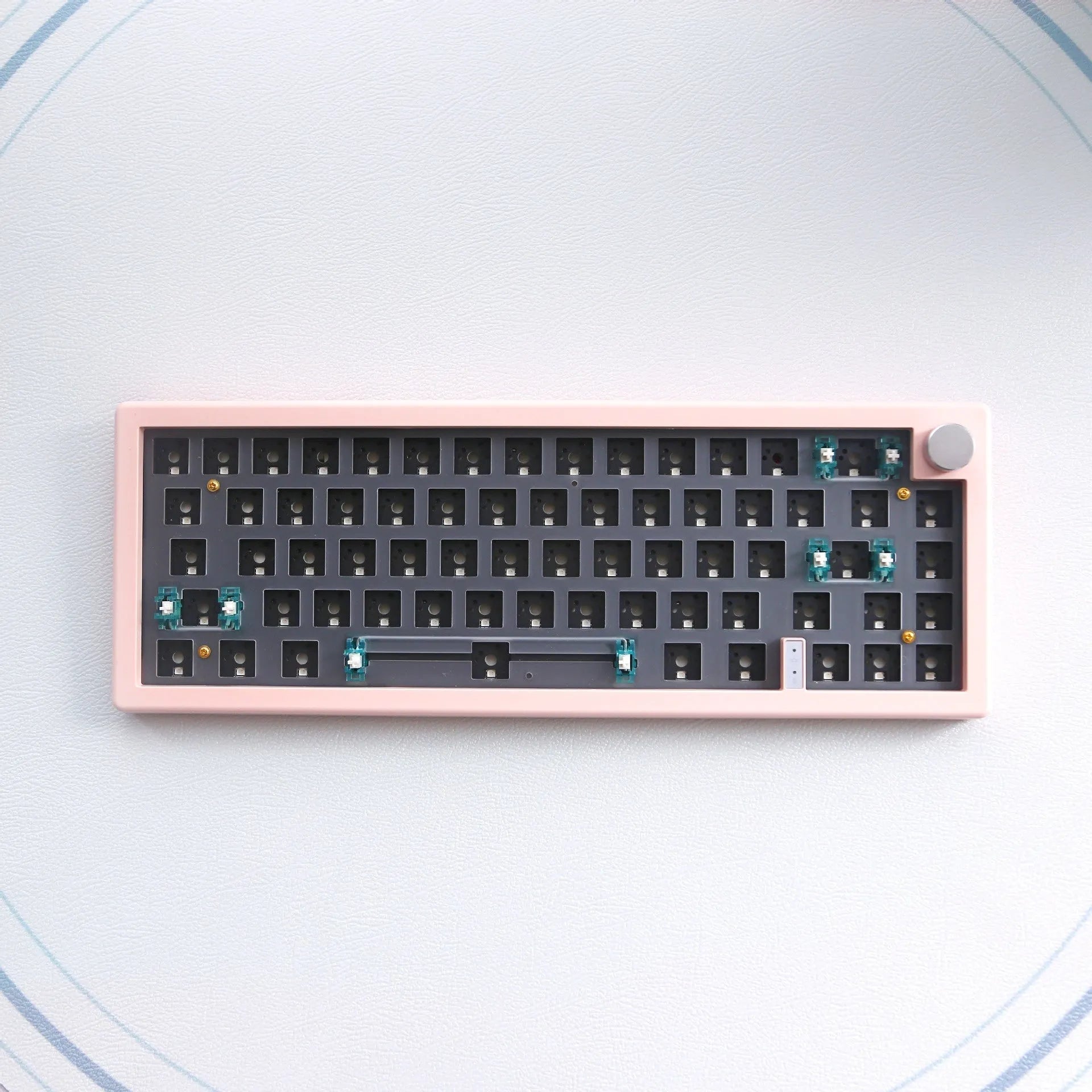 DIY hot-swappable mechanical keyboard kit with RGB lighting and rotary knob in seven colour options