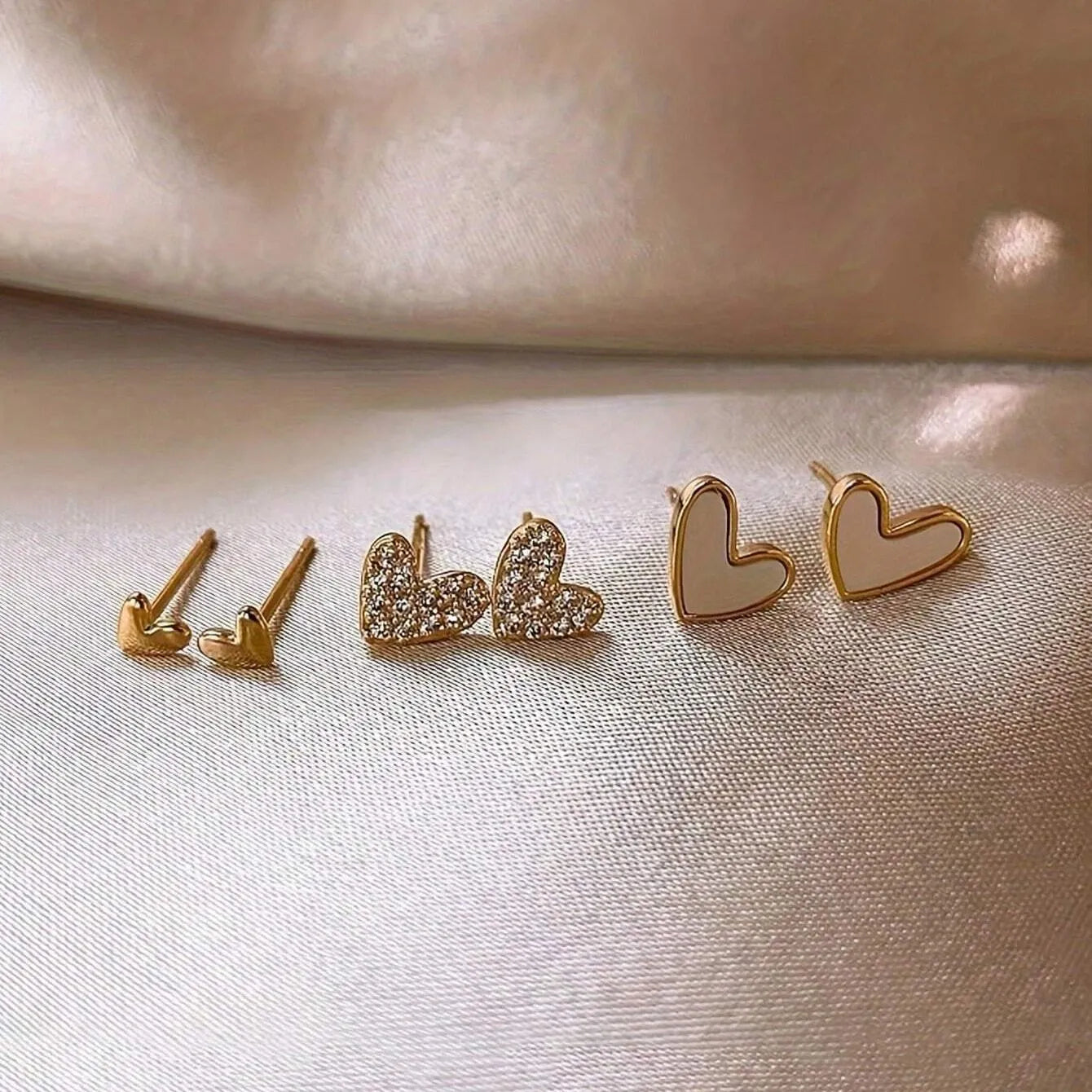 Women's fashion heart earrings set with 3 pairs in gold, black, and pink alloy electroplated colours