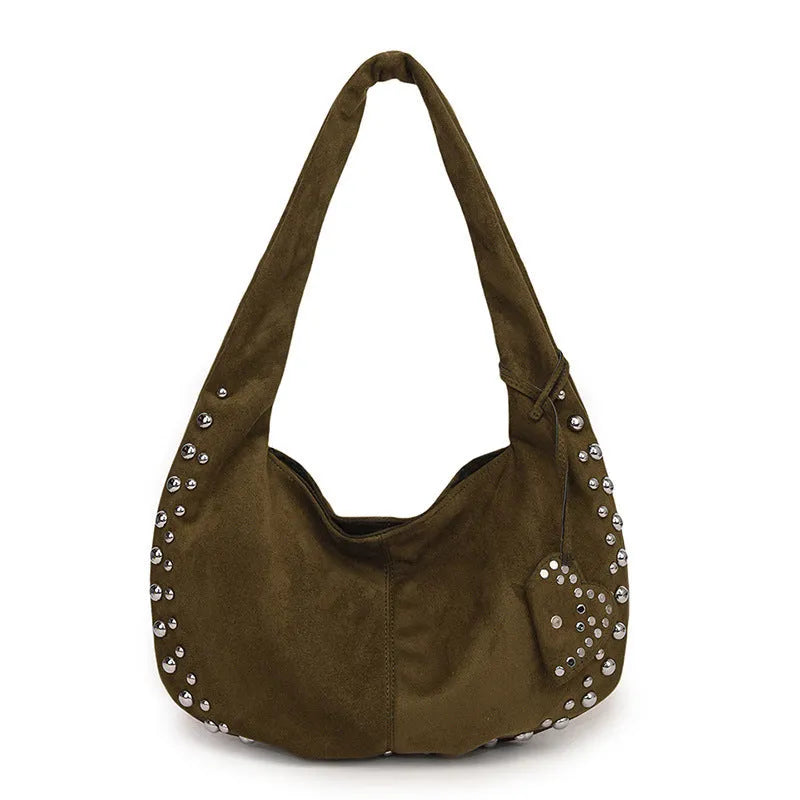 A soft plush retro style tote handbag for women in a strapless design, shown in a choice of colours.