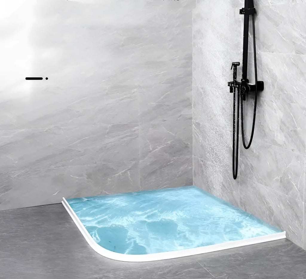 Flexible TPE bathroom water blocking strip in black on white tile floor