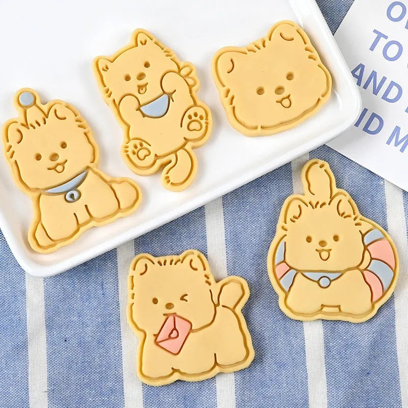 Three-dimensional plastic biscuit mould with puppy cartoon designs for making decorated dog-themed cookies and candies