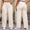 Women's high-waisted straight leg wide jeans in apricot colour on a hanger.