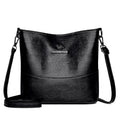 Women's soft leather large capacity bucket shoulder bag in minimalist luxury style with sewing line details.