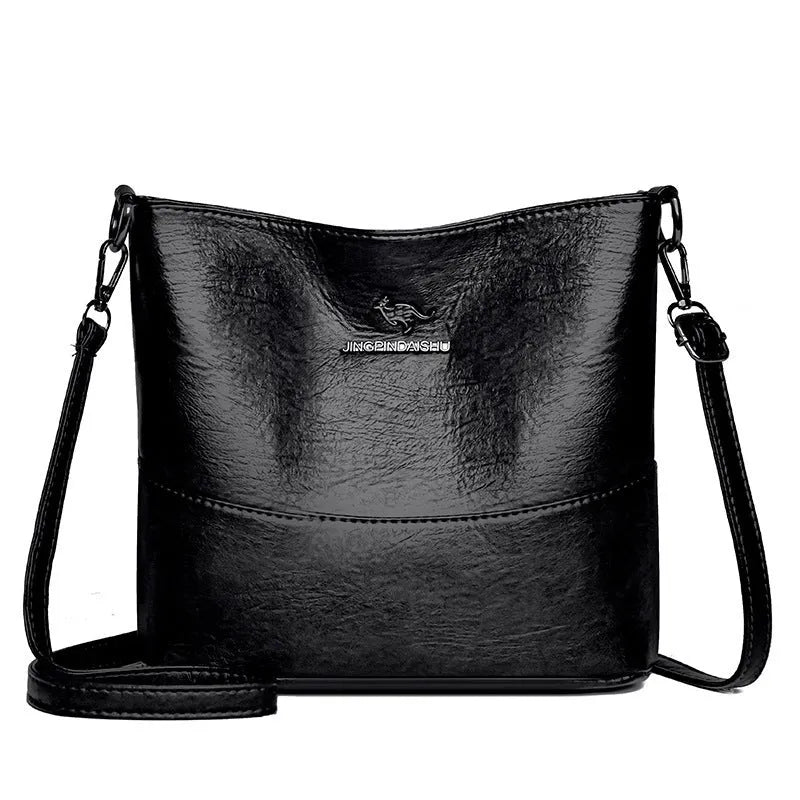 Women's soft leather large capacity bucket shoulder bag in minimalist luxury style with sewing line details.
