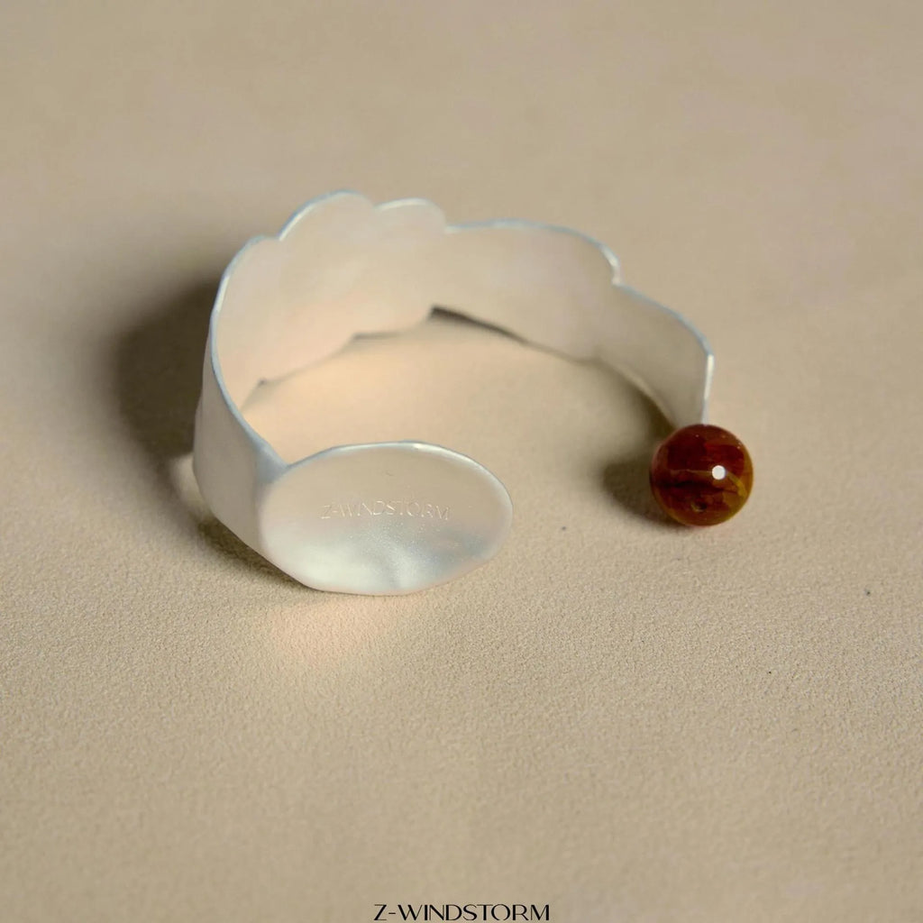 Silver tone alloy ring and bracelet set with a small stewed pork motif on diamond-shaped charms.