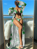 Women's blue long sleeve bikini top and banded briefs with a matching robe laid flat.