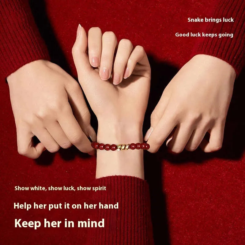 Handmade Chinese-style cinnabar bracelet with snake beads for Year of Snake body protection.