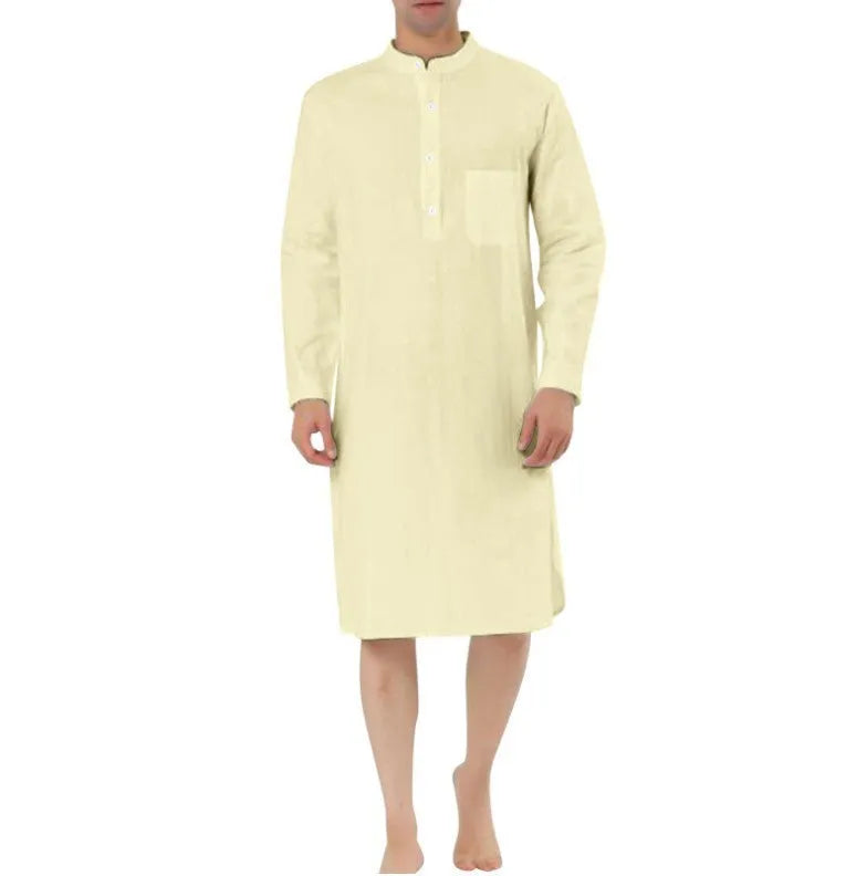 Man wearing a dark blue cotton shirt robe with button front and chest pockets.