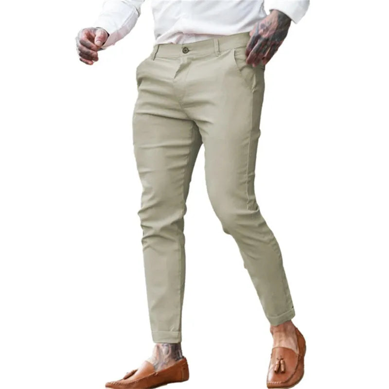 Men's slim fit pencil trousers in cotton twill fabric with stretch, showing mid waist and tapered leg.
