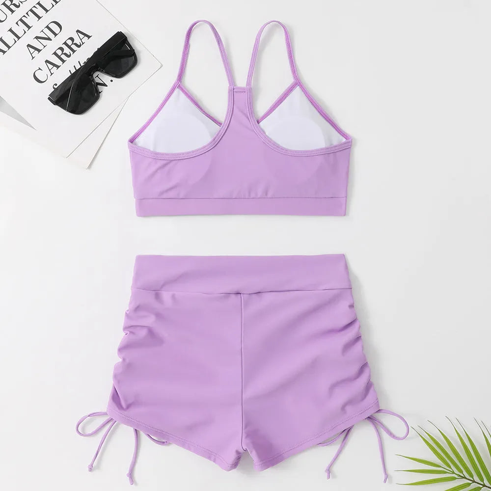 Women's high waist split swimsuit in black or purple with nylon spandex construction