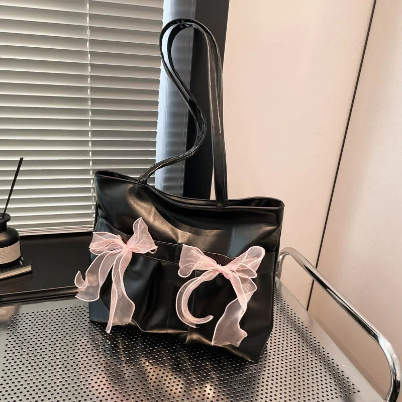 College style bow tote bag in black and pink with large capacity and internal zip compartment