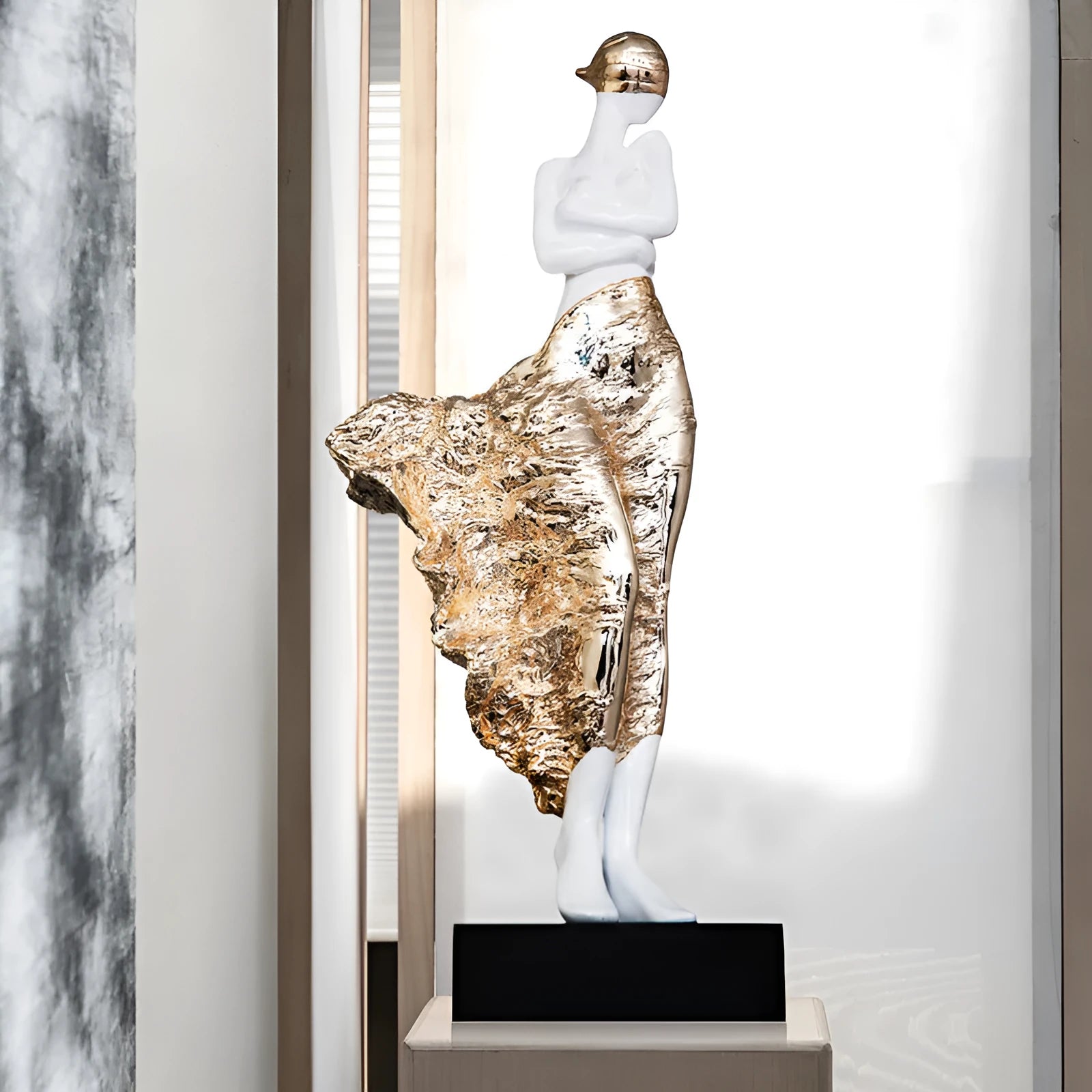 48cm tall sculptured character ornament in metallic rose gold finish with modern minimalist design
