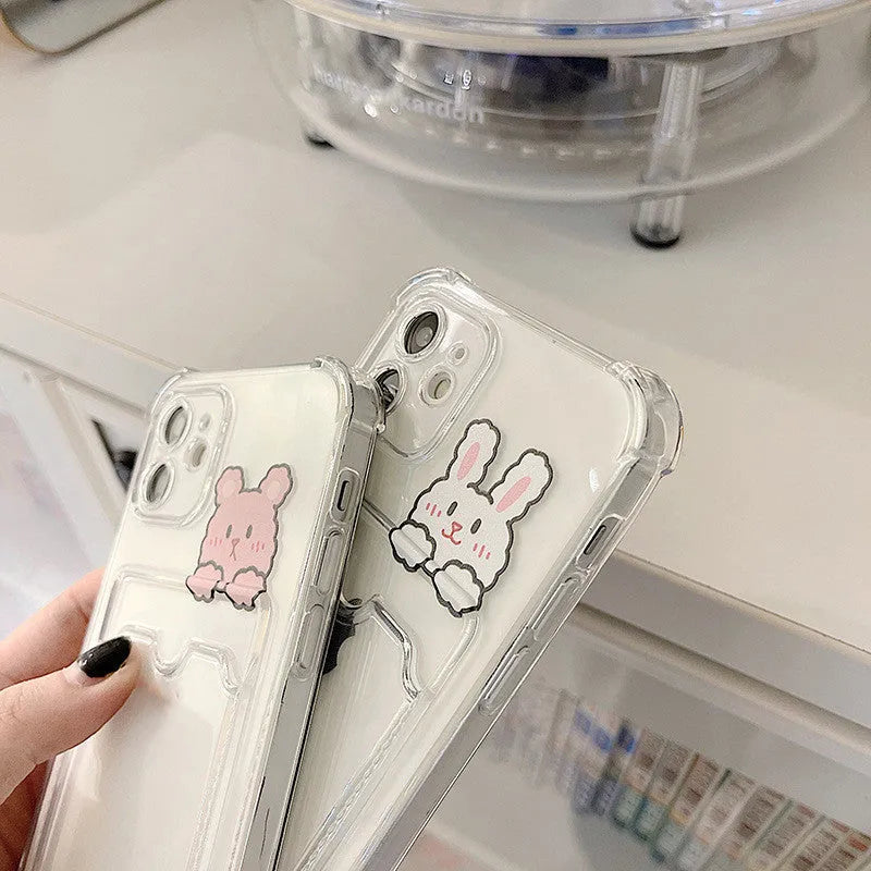 Transparent cartoon printed phone case with card slots for Apple iPhone.