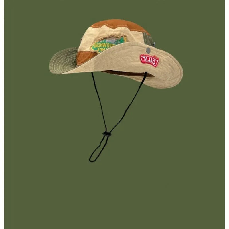 Army green cotton fisherman hat with flat top crown and hand-painted patchwork details, shown folded and unfolded