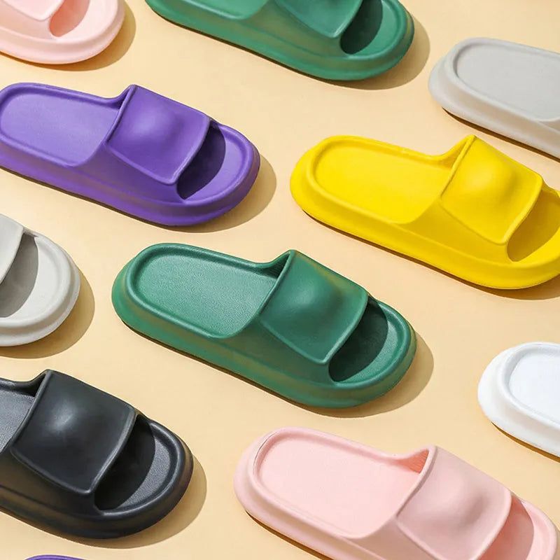Unisex thickened EVA flip-flop slippers in black with a non-slip sole for bathroom use.
