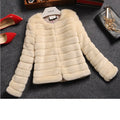 Women's short-sleeved faux fur top in beige, shown on a model for street fashion.