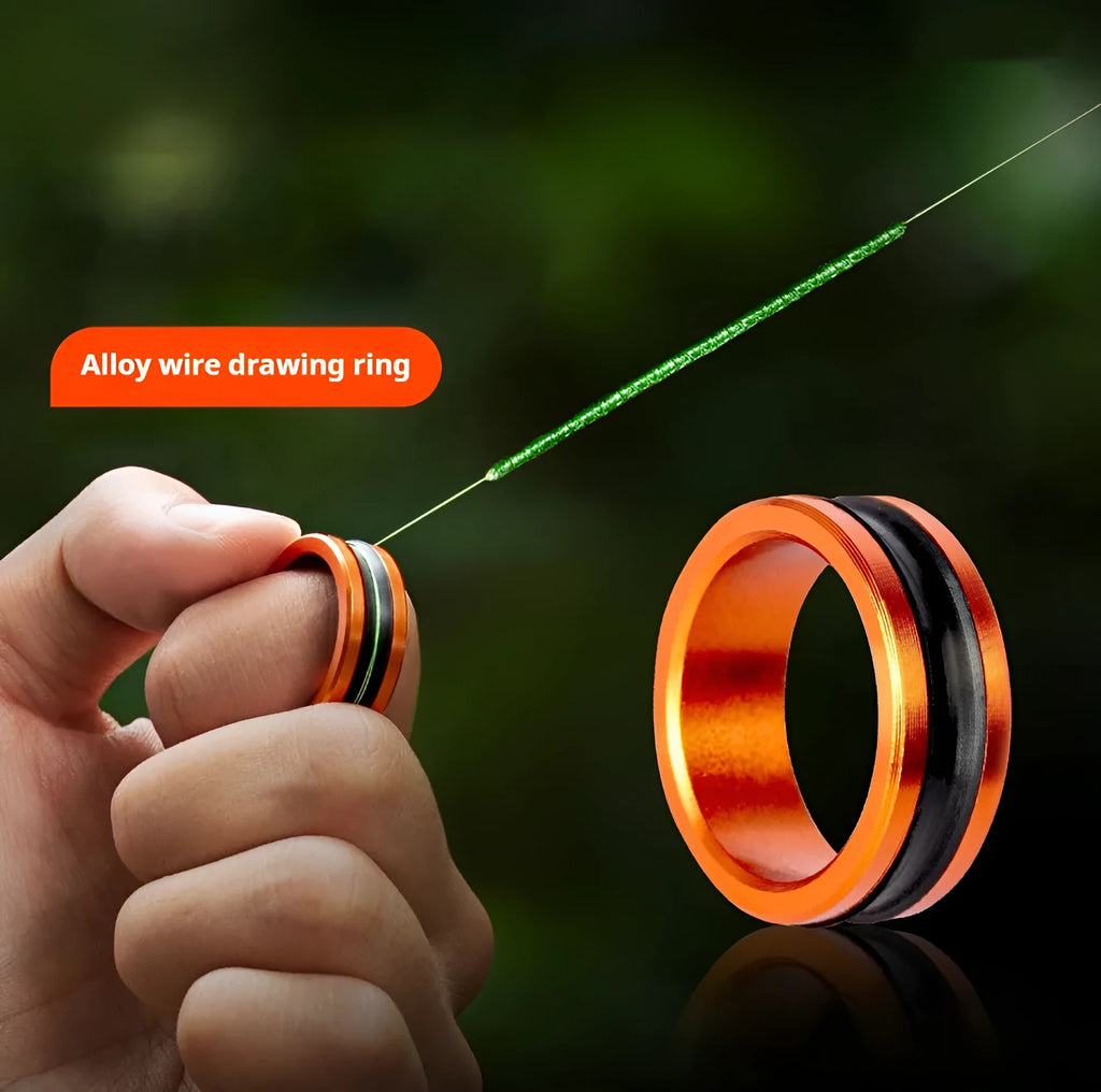 Orange and silver alloy fishing hand guard pull loop tool with textured non-slip surface.