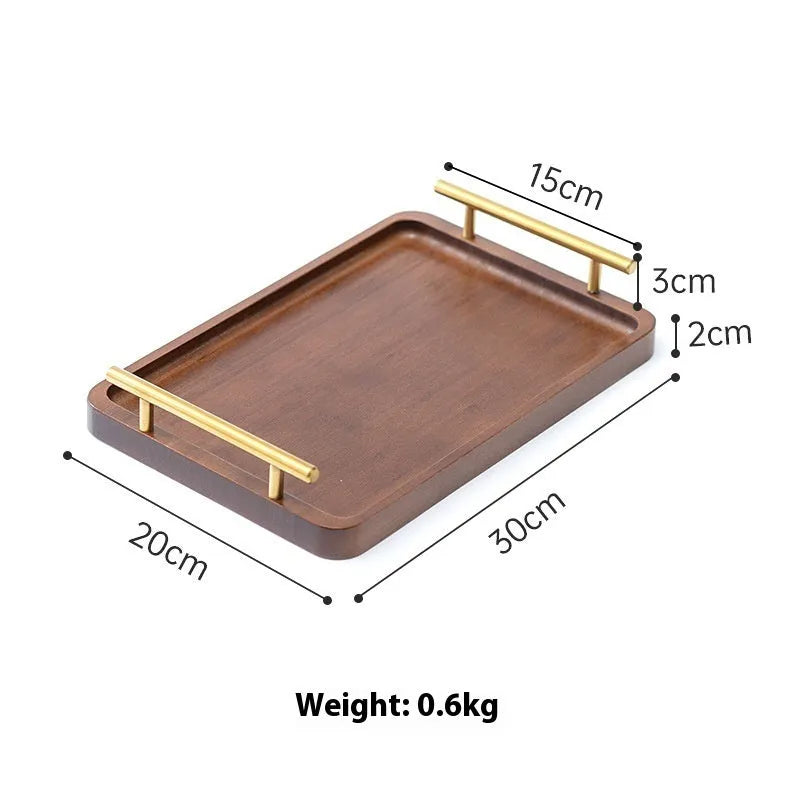 Square bamboo serving tray with brown handle on solid colour background