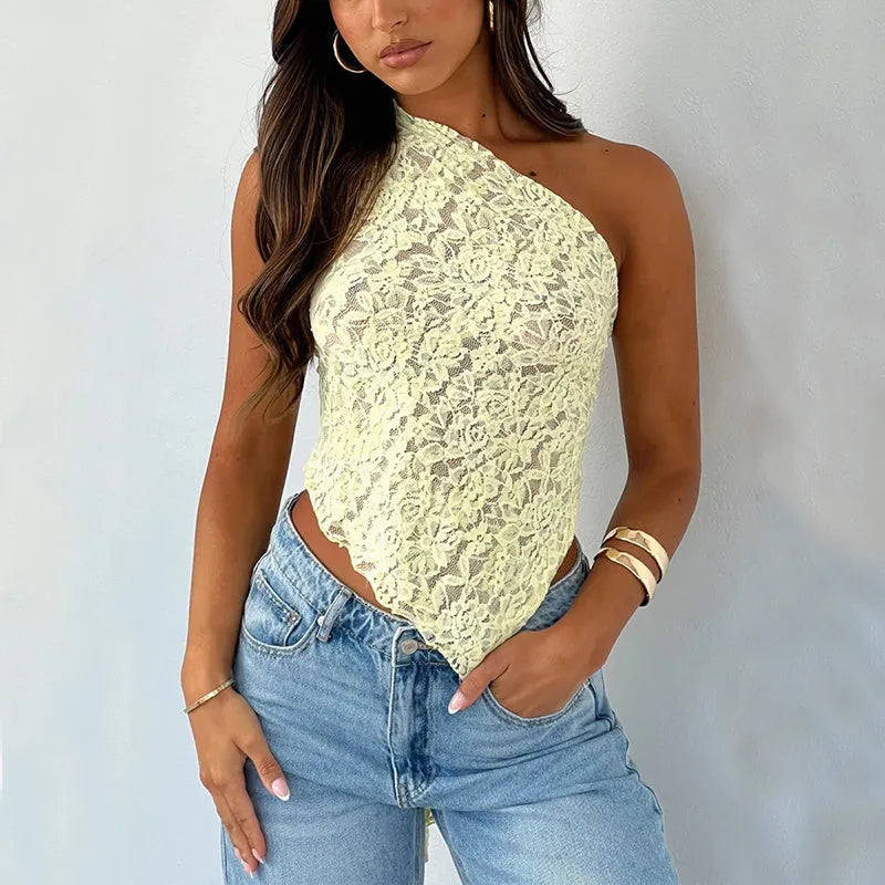 Women's apricot sleeveless vest top with lace back panel and asymmetrical neckline on a hanger.