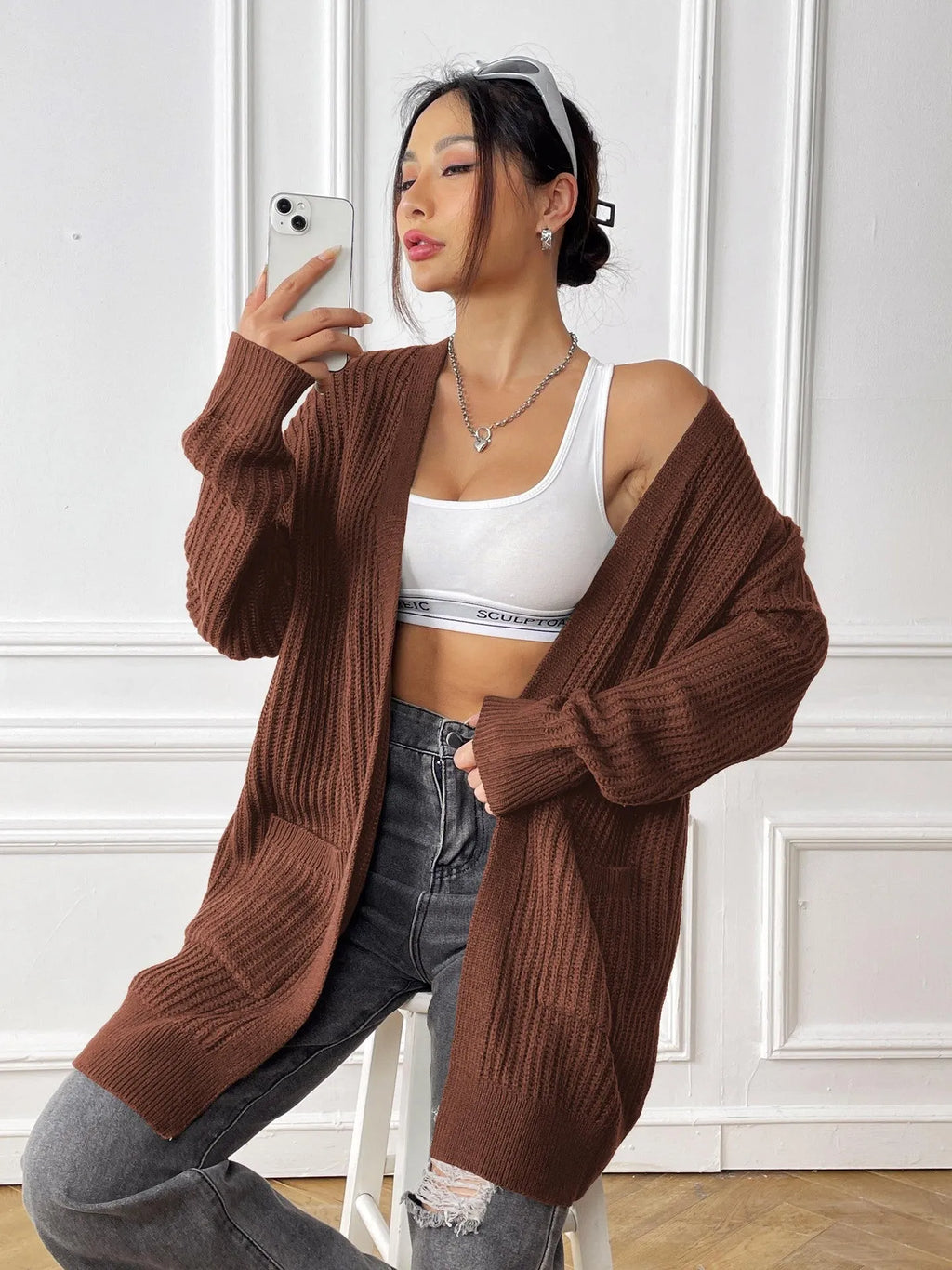 Women's loose fit acrylic cardigan sweater with double pockets in dark green colour