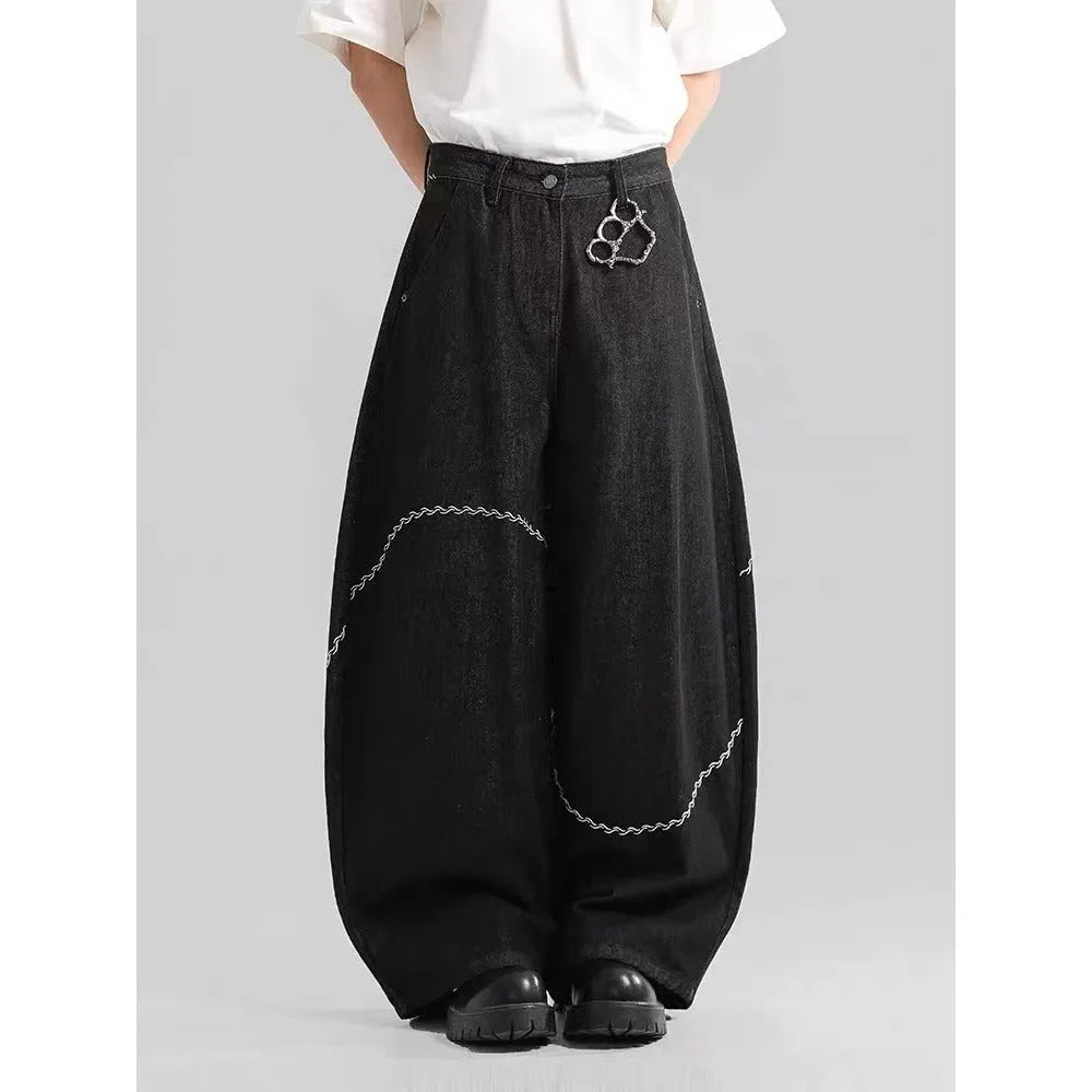 Black straight-leg jeans with micro-elastic polyester denim fabric showing zip fly and mid-rise waist