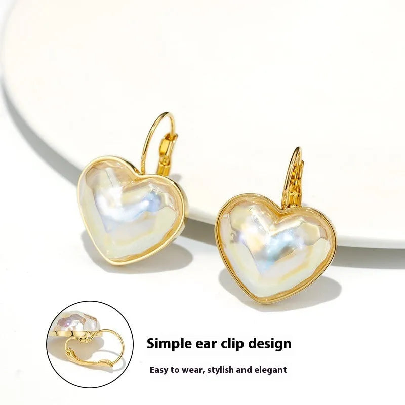 Gold coloured women's clip-on earring made from alloy with metal design details.