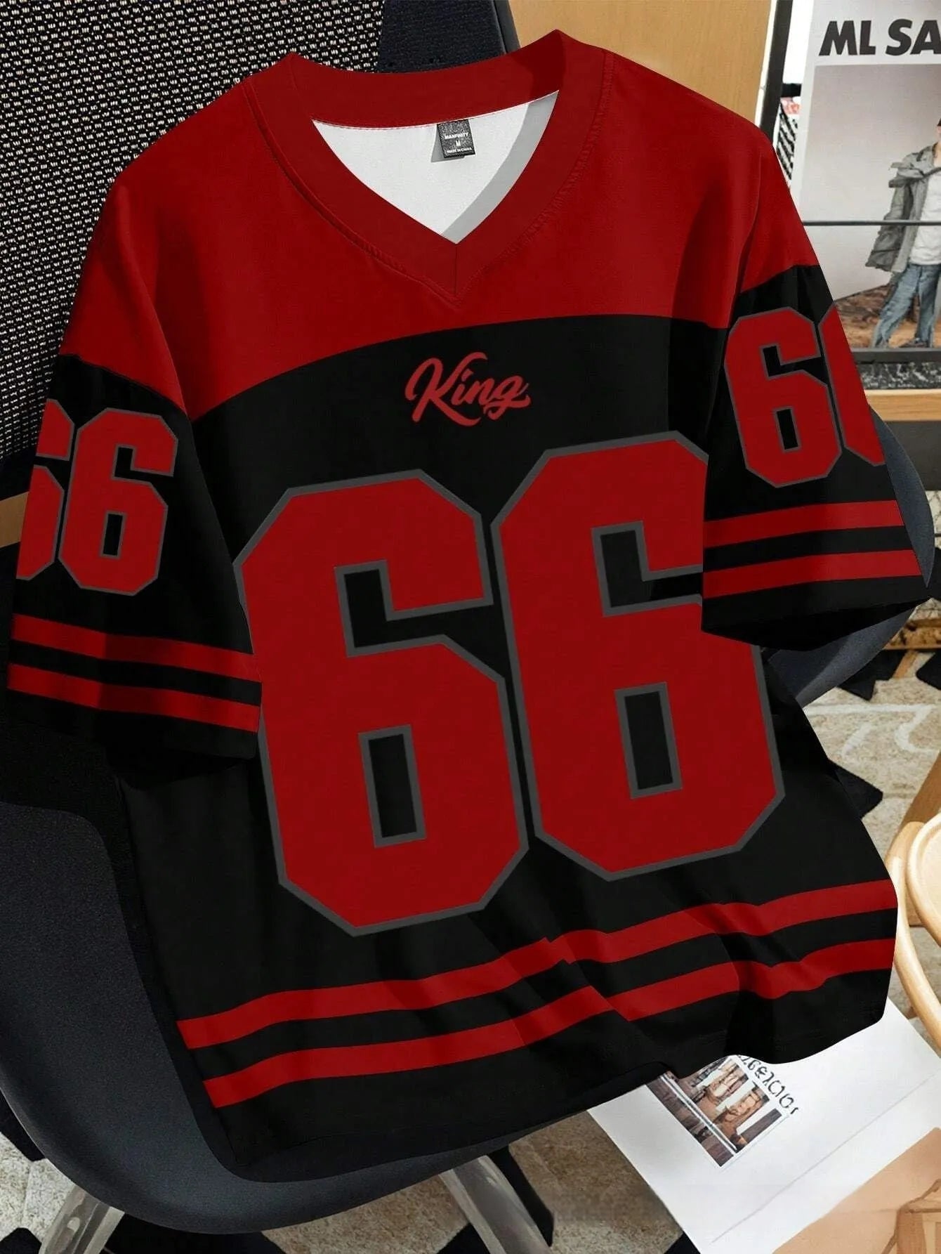 Man wearing a grey Chicago Bulls No 23 striped t-shirt with a 3D print, round neck, and short sleeves.