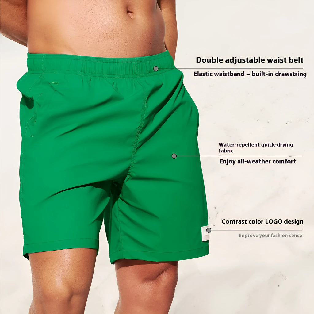 Men's solid colour quick-drying nylon beach shorts on a hanger, showing straight leg opening.