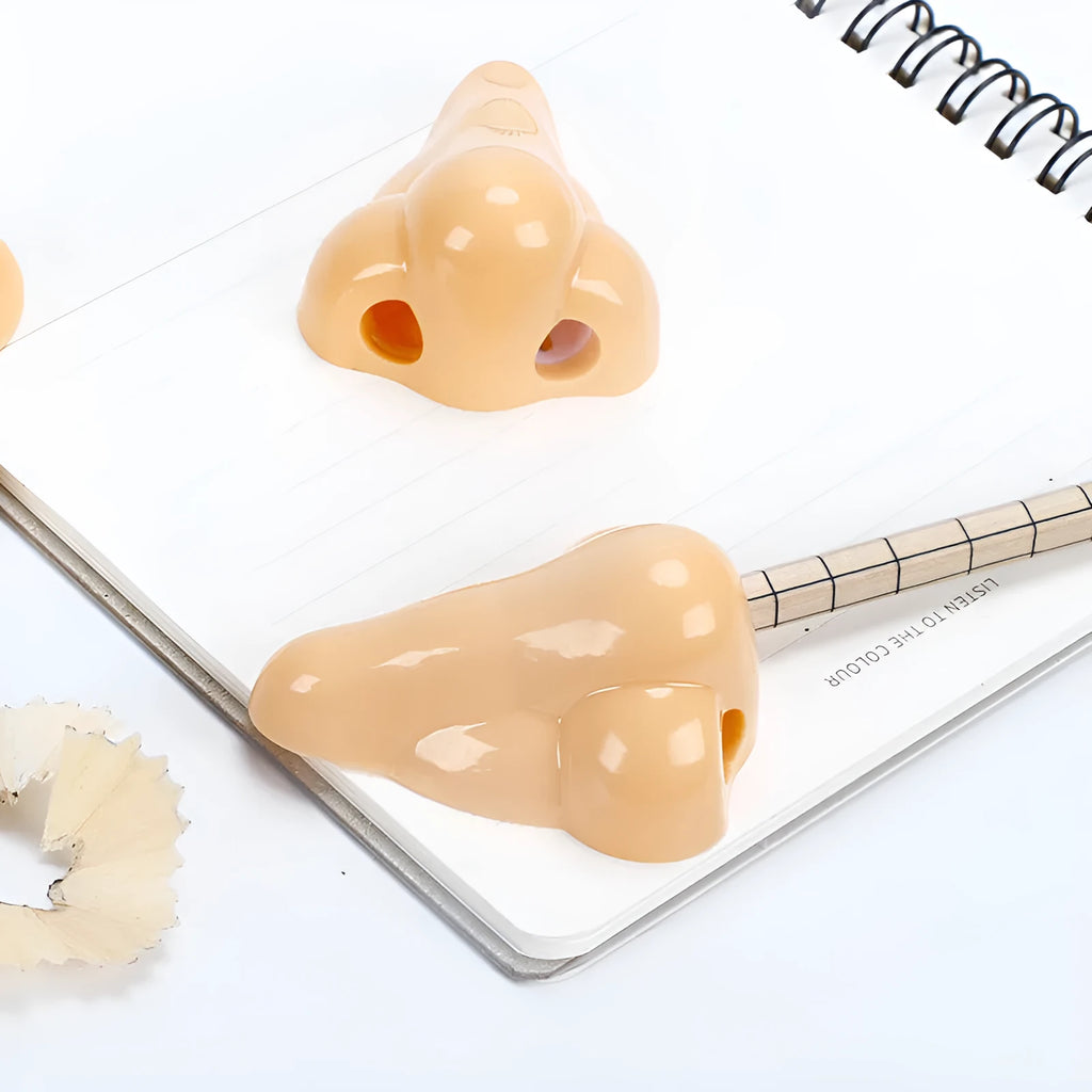 Flesh coloured geometry-shaped plastic pencil sharpener with big nostril opening